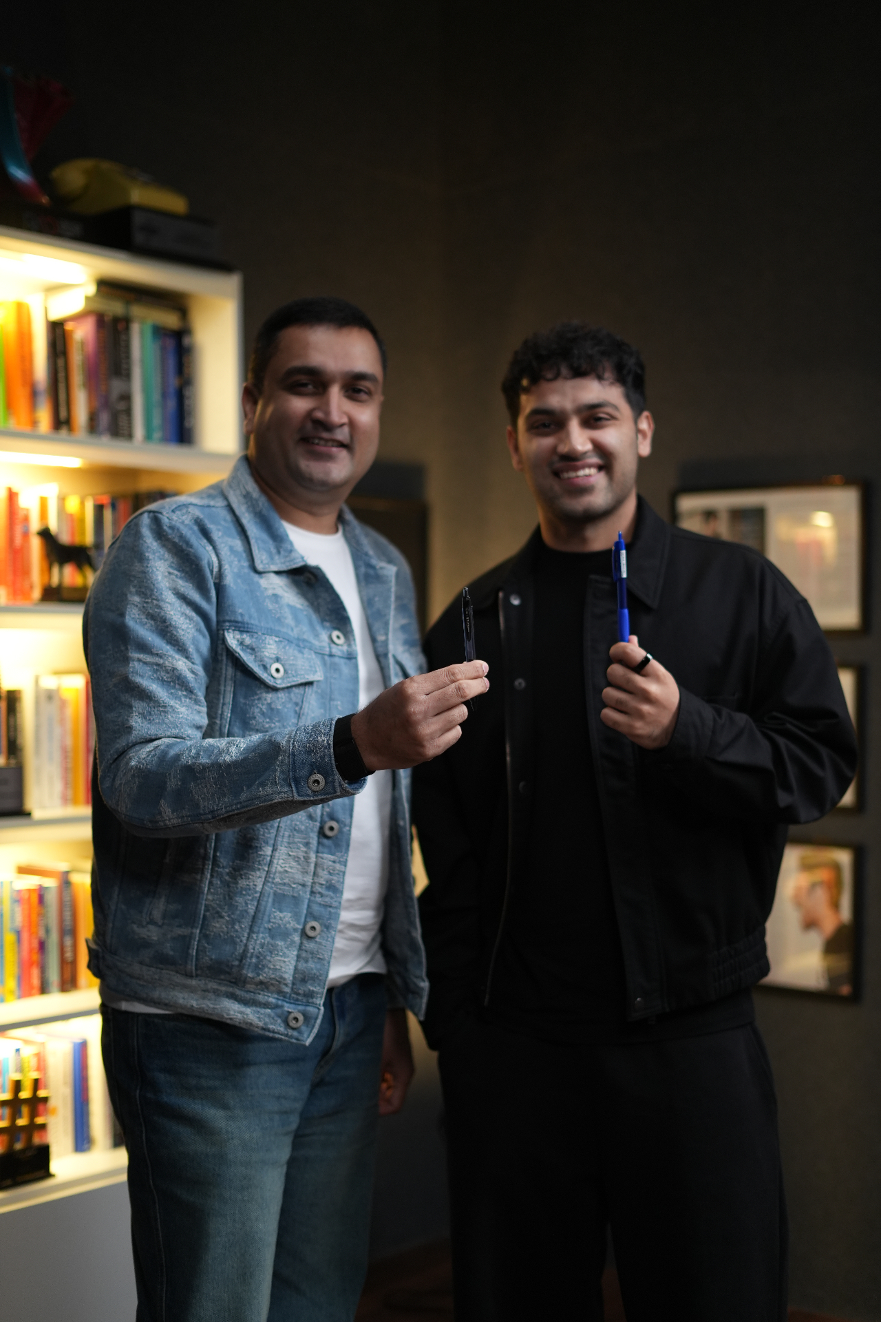 Imran Baig with Raj Shamani holding pens after the Figuring Out podcast